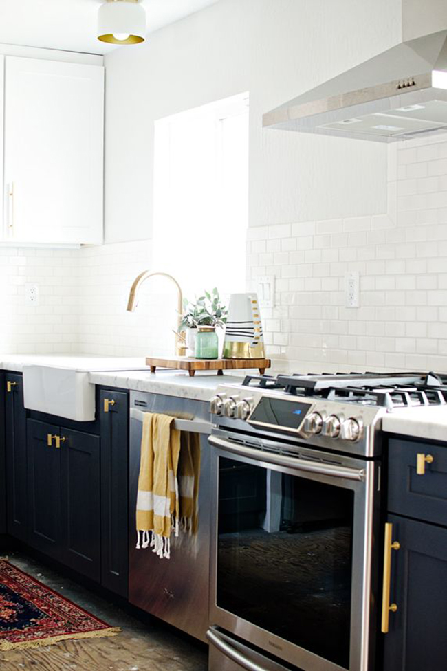 Navy blue cabinets with brass hardware