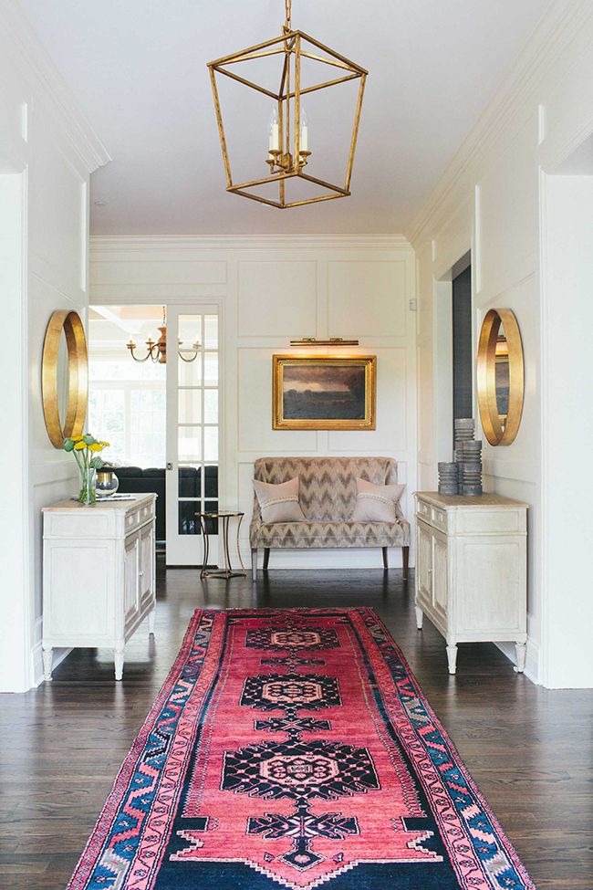 pink and blue persian rug in elegant entryway
