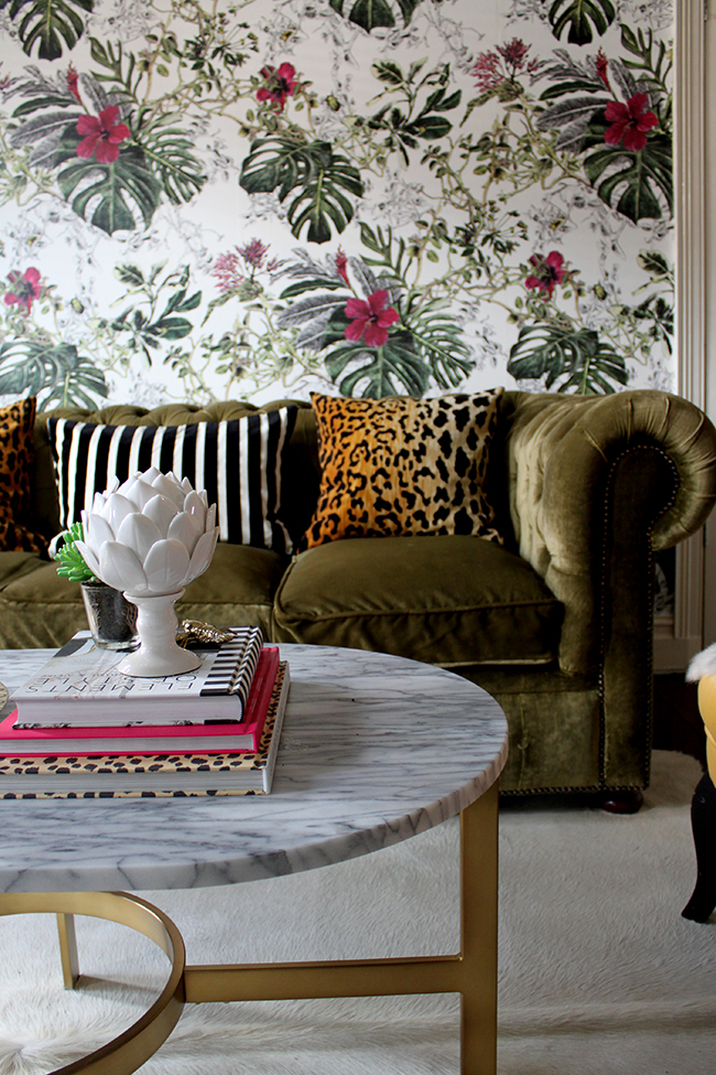 Swoon Worthy Living Room - tropical wallpaper, olive green velvet chesterfield with leopard cushions and marble coffee table