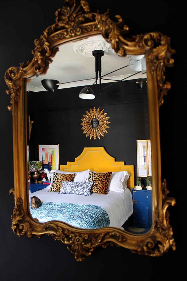 Swoon Worthy master bedroom - mirror reflection - black bedroom, yellow headboard