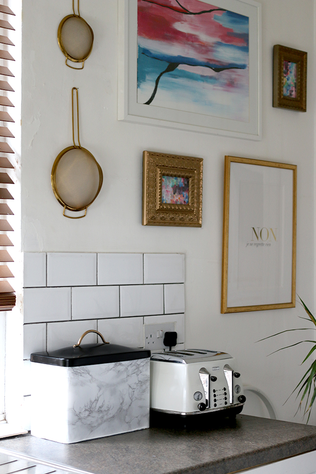 My Faux Marble DIY Bread bin in situe within my glam white and gold kitchen