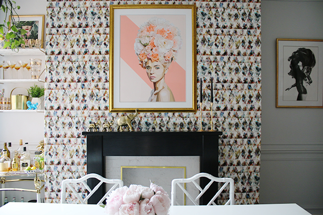 graphic feature wallpaper on chimney breast, black and white marble fireplace with gold trim, peonies - see more on www.swoonworthy.co.uk