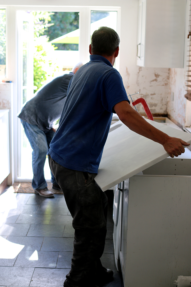 Setting the worktops into place... VERY carefully.