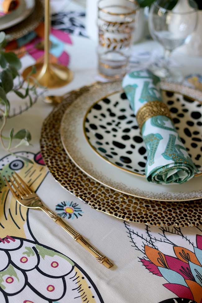 Colourful table setting with plants and animal prints