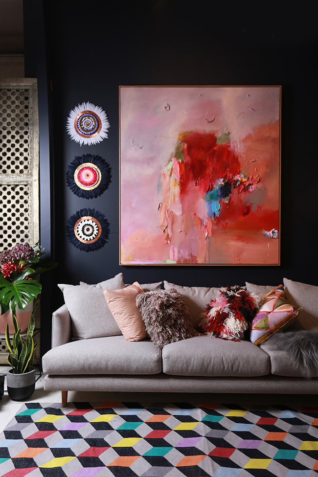 dark walls with blush pink artwork