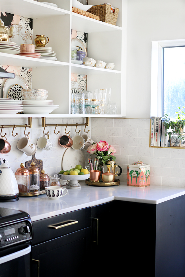 eclectic boho glam kitchen with open shelving and gold and copper accents