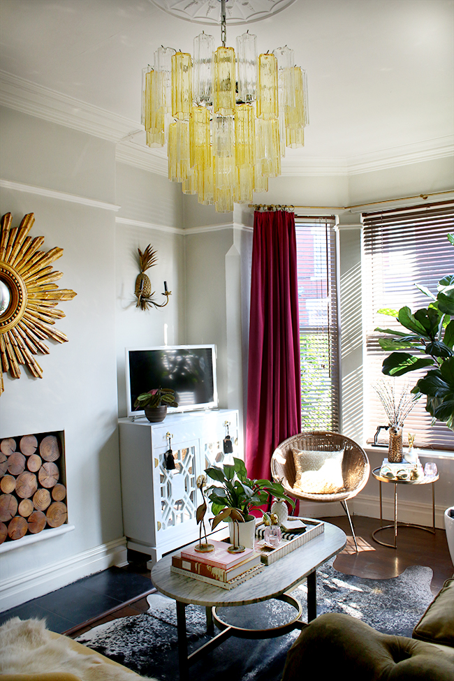 eclectic glam living room with murano glass chandelier