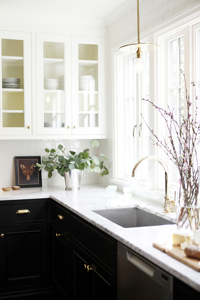 To create more visual space in your small kitchen installing cupboards with glass doors is a great idea.