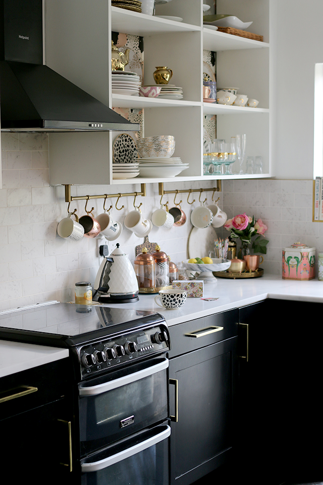 black and white kitchen with open shelving