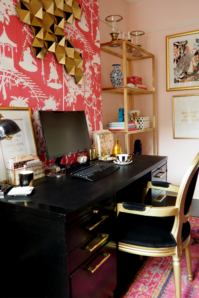 boho glam office with black desk and gold brass glass shelving units