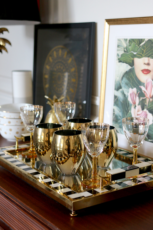 black gold and white tray with vintage glasses