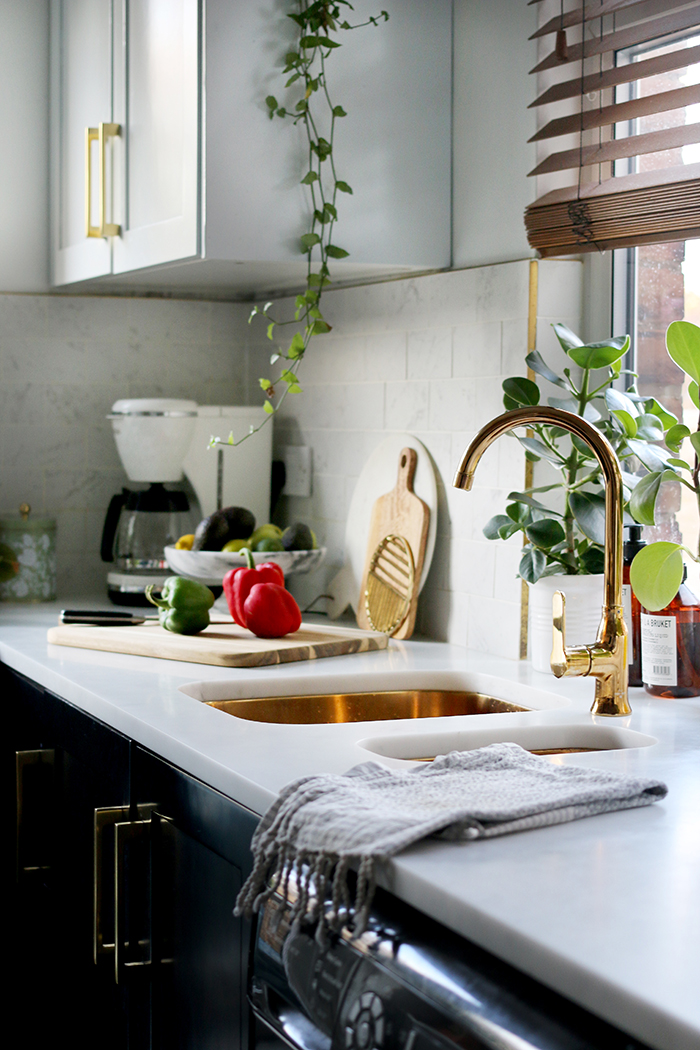 kitchen with gold sink and tap