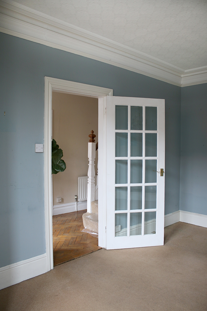 blue empty dining room with glass door