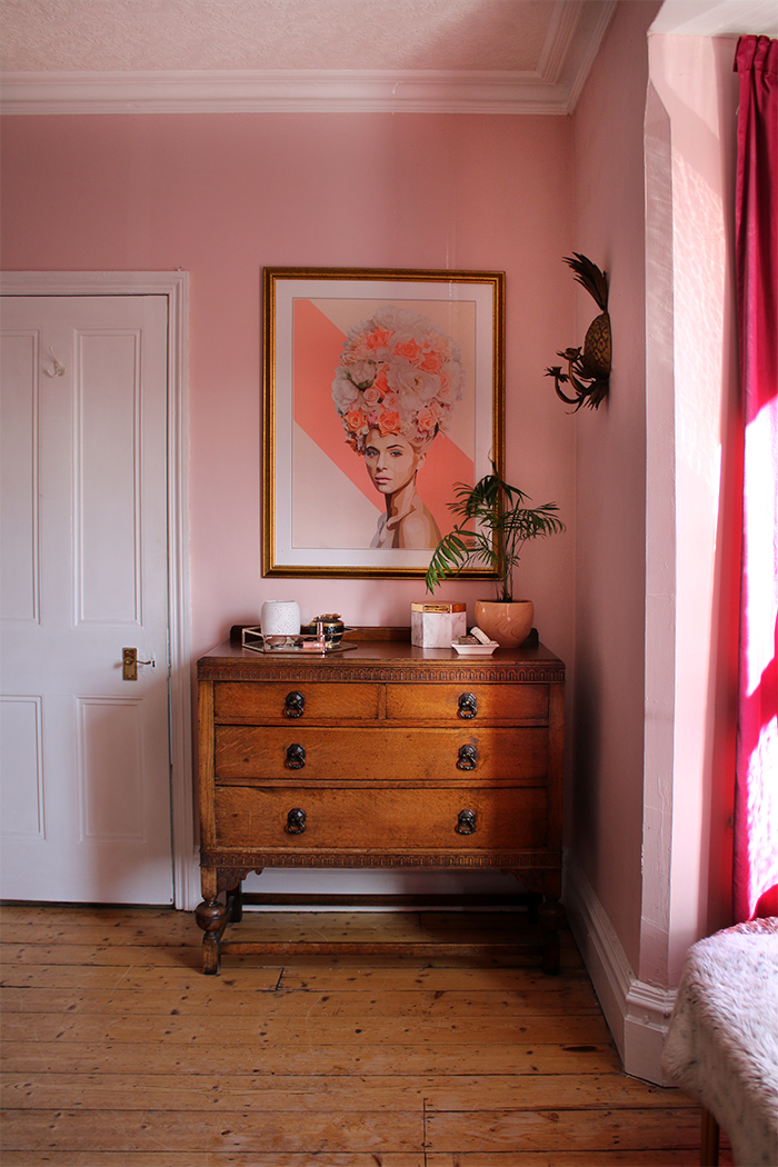 vintage chest of drawers with artwork in pink and peach