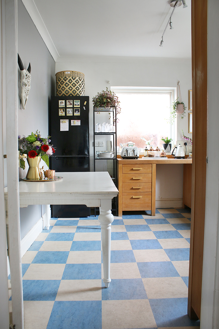 looking into kitchen with vinyl flooring