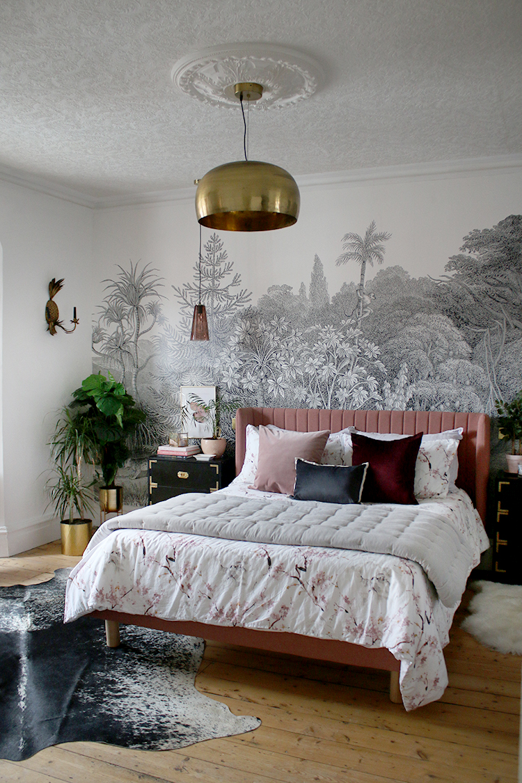 jungle glam bedroom in black white and gold with pink bed