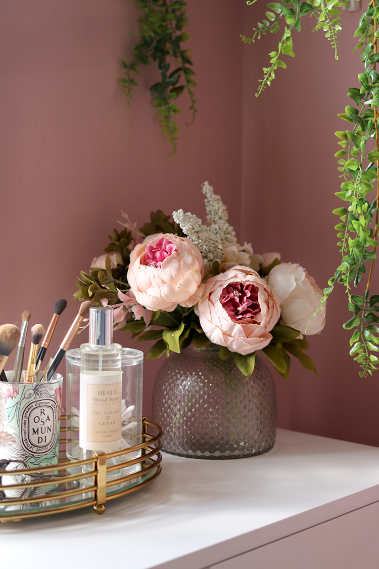 vanity styling with pink walls and peonies