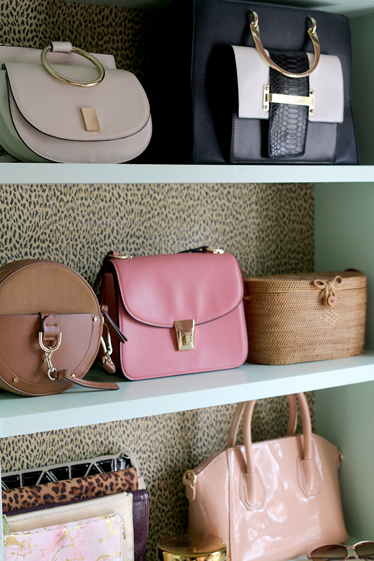 handbags on shelving unit display
