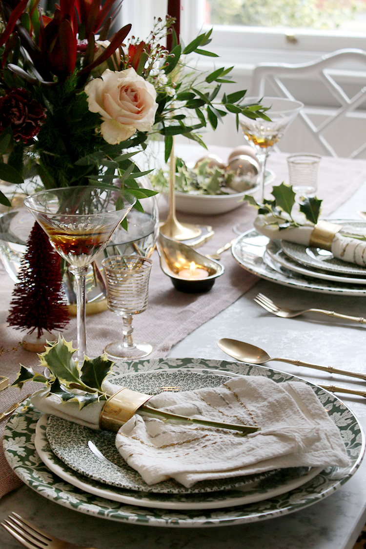 Christmas dinner table setting styling in green and pink