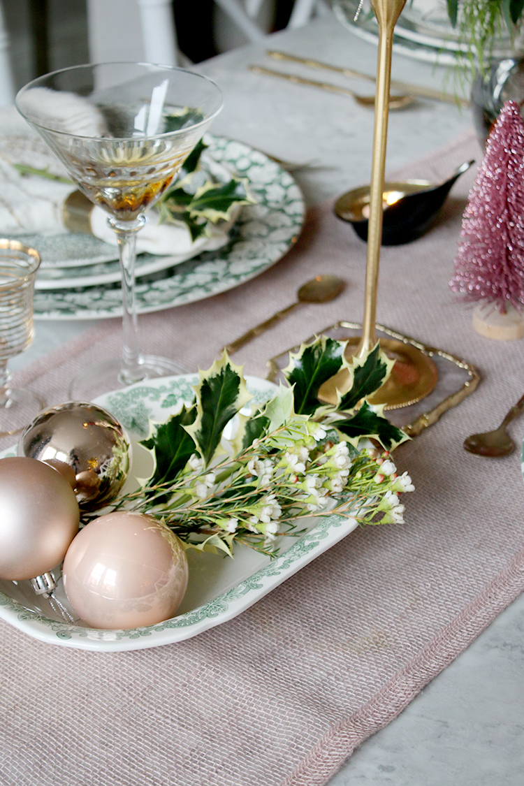 Christmas table setting with baubles and greenery styling