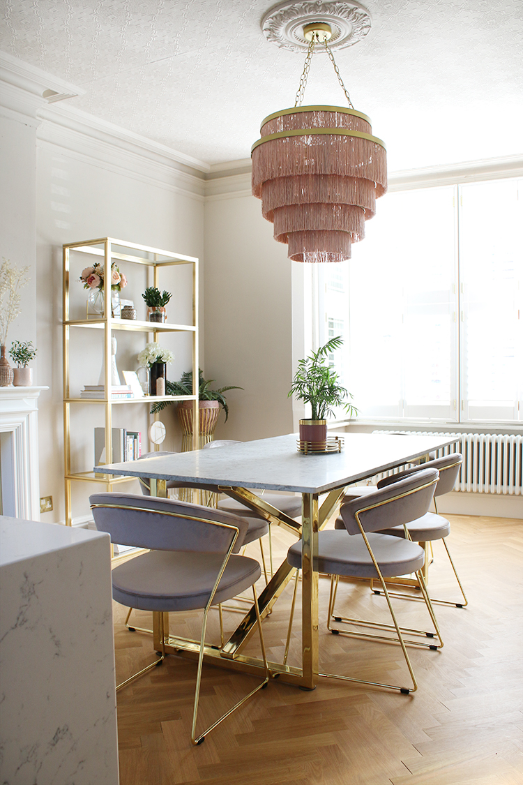 dining room with parquet flooring in taupe and pink with marble table
