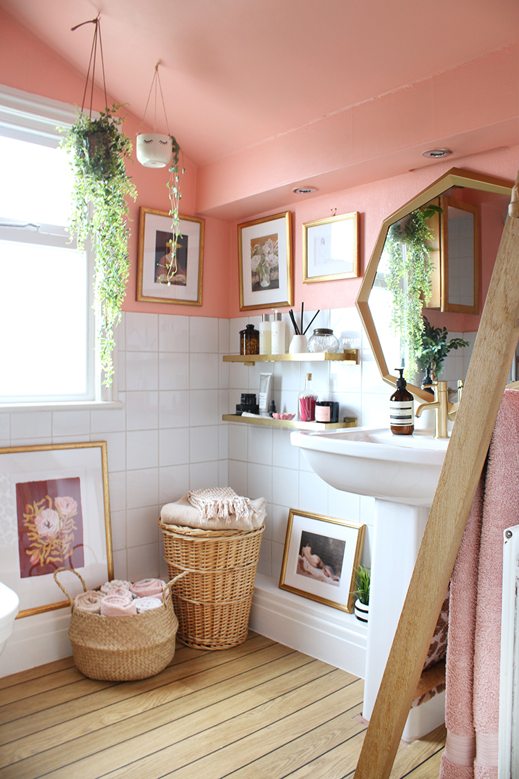 Peach bathroom refresh with gold accents and greenery