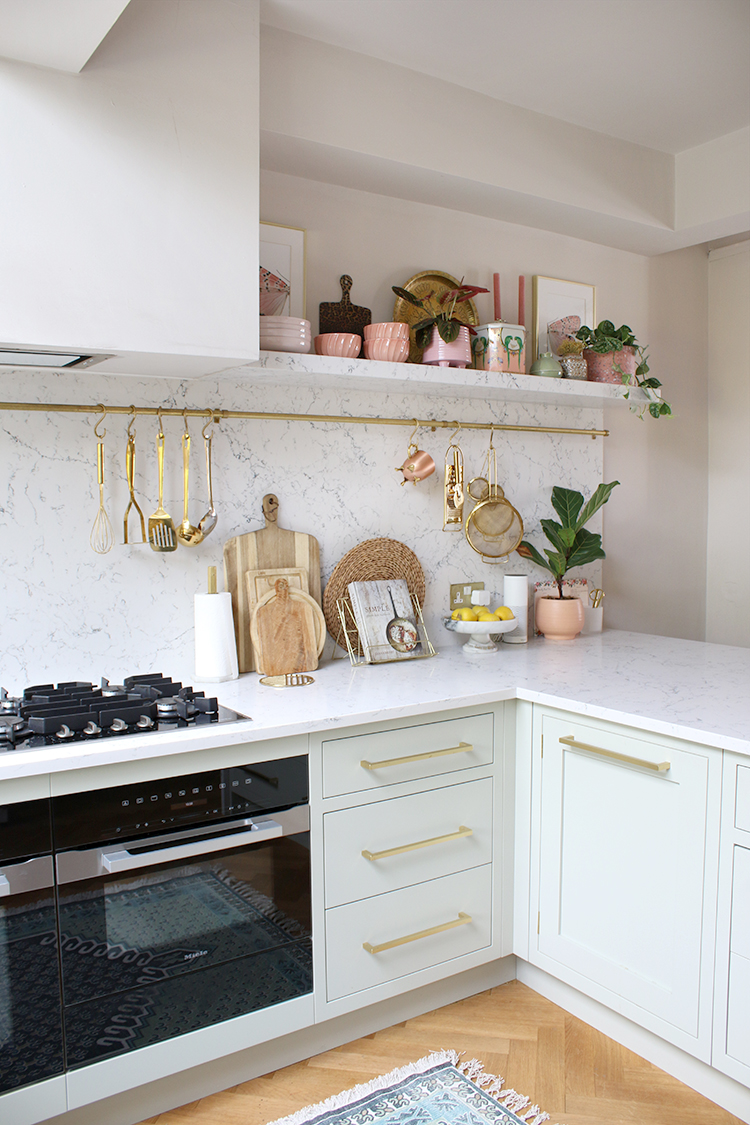 Corner of kitchen with single open shelf