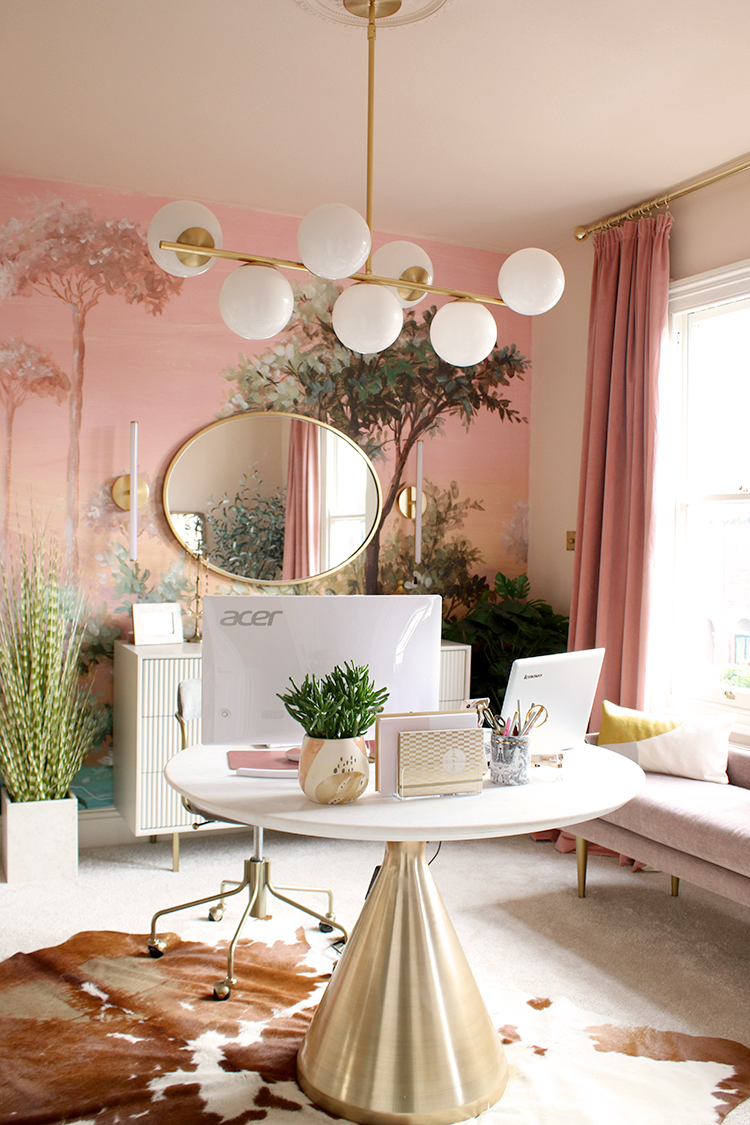 pink and peach office with round desk in middle of room