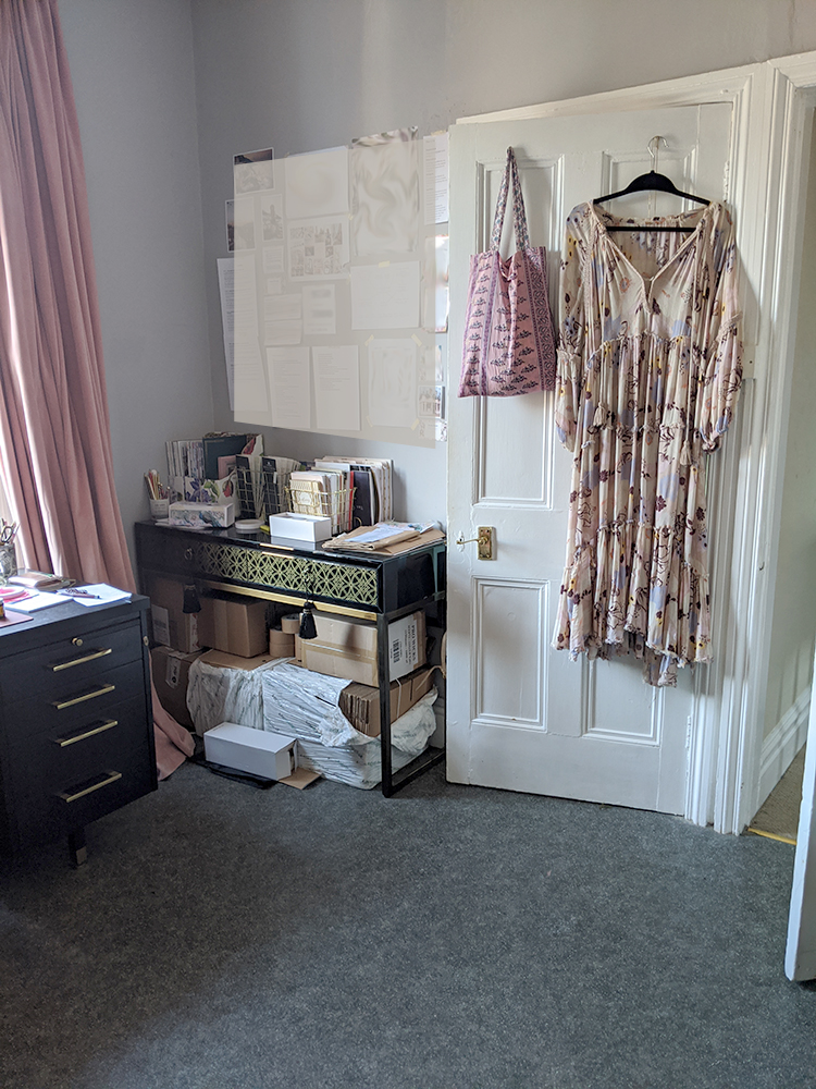 pink and peach office with round desk in middle of room